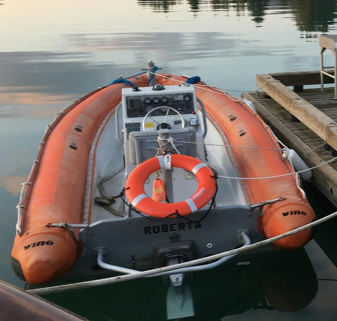 a cockpit of an orange and white airplane aboard SACAJAWEA Yacht for Sale