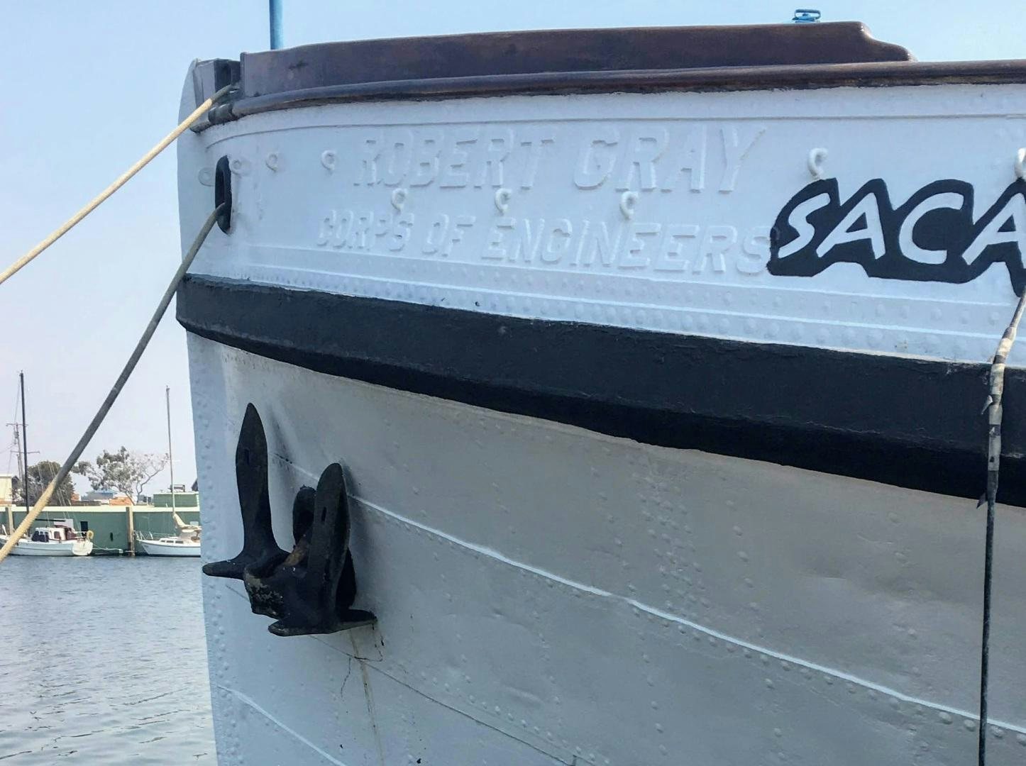 a boat with a sign on the side aboard SACAJAWEA Yacht for Sale