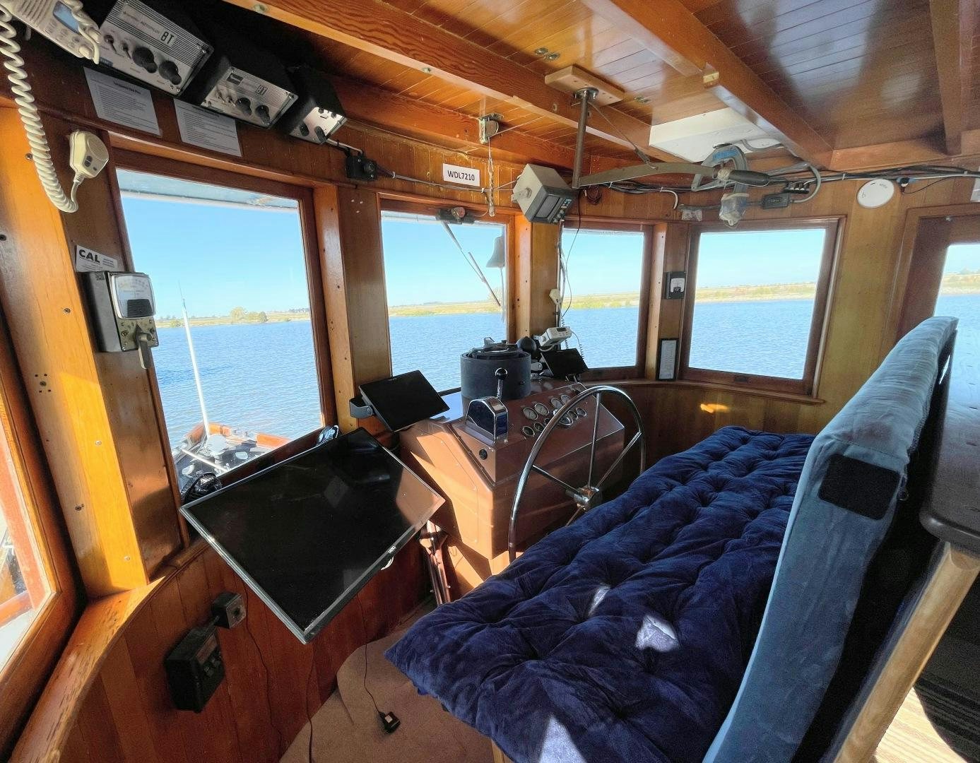 a boat with a desk and a computer aboard SACAJAWEA Yacht for Sale