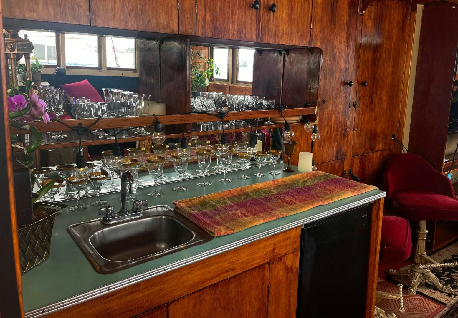 a bar with a table and chairs aboard SACAJAWEA Yacht for Sale