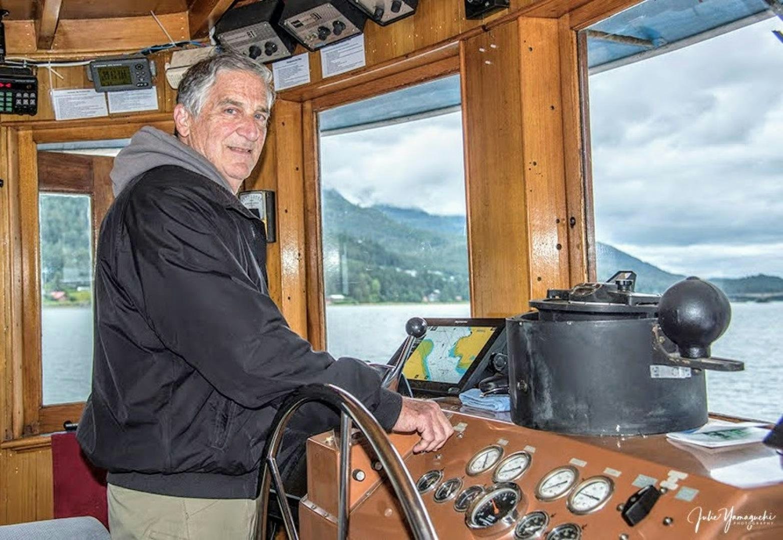 a person playing the piano aboard SACAJAWEA Yacht for Sale