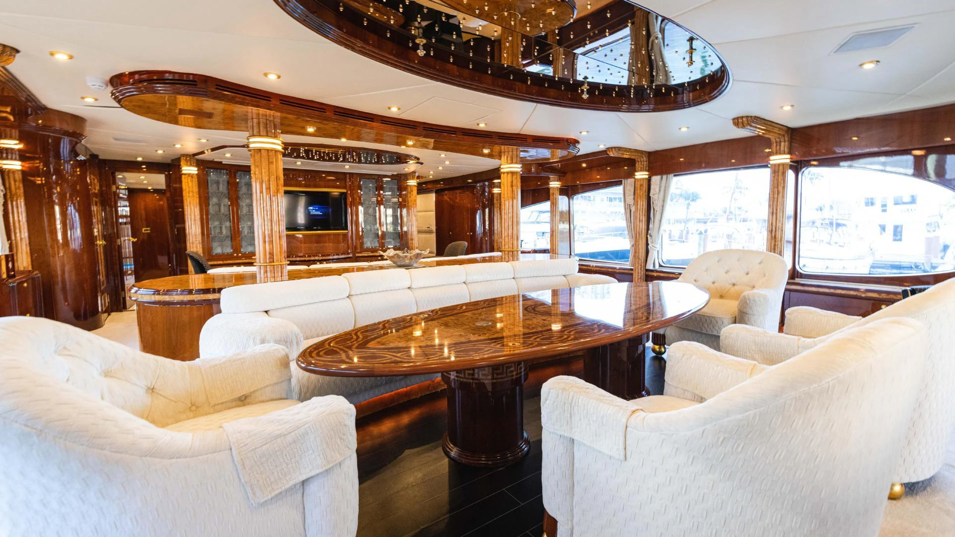 a room with couches and a table aboard ARTHUR’S WAY Yacht for Sale