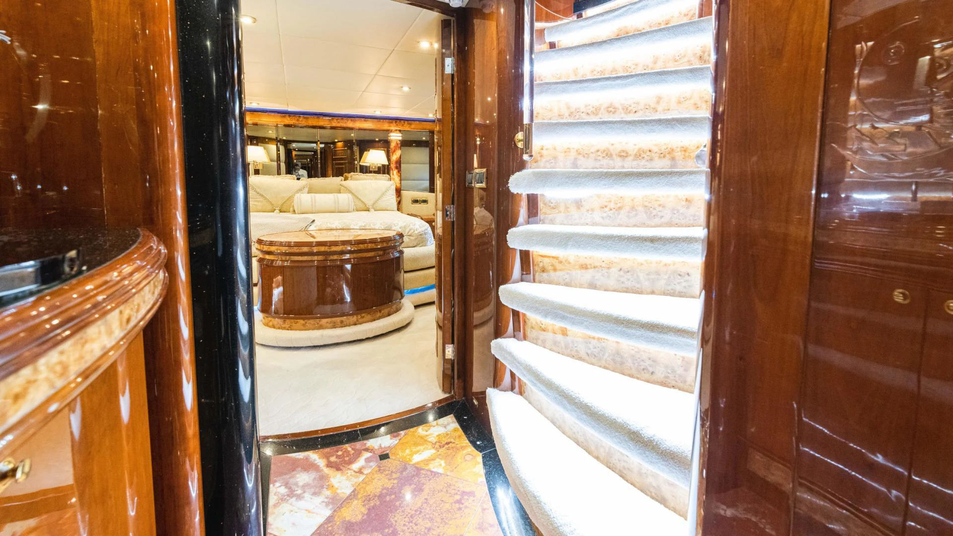 a room with a staircase and wood doors aboard ARTHUR’S WAY Yacht for Sale