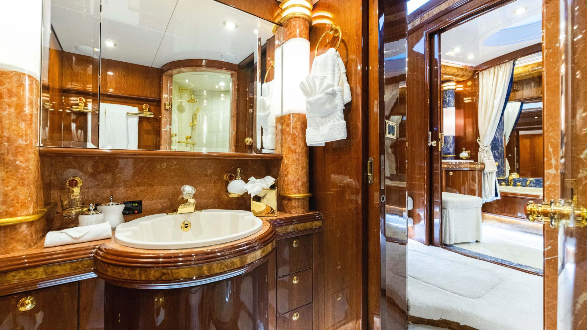 a bathroom with a sink and mirror aboard ARTHUR’S WAY Yacht for Sale