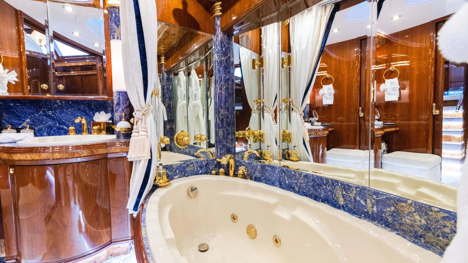 a bathroom with a large bathtub aboard ARTHUR’S WAY Yacht for Sale