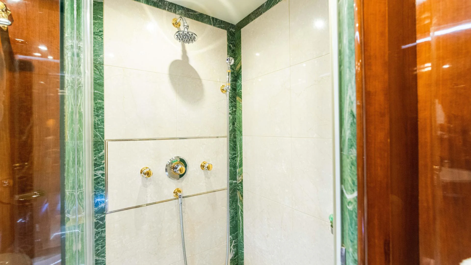 a door with a green handle aboard ARTHUR’S WAY Yacht for Sale