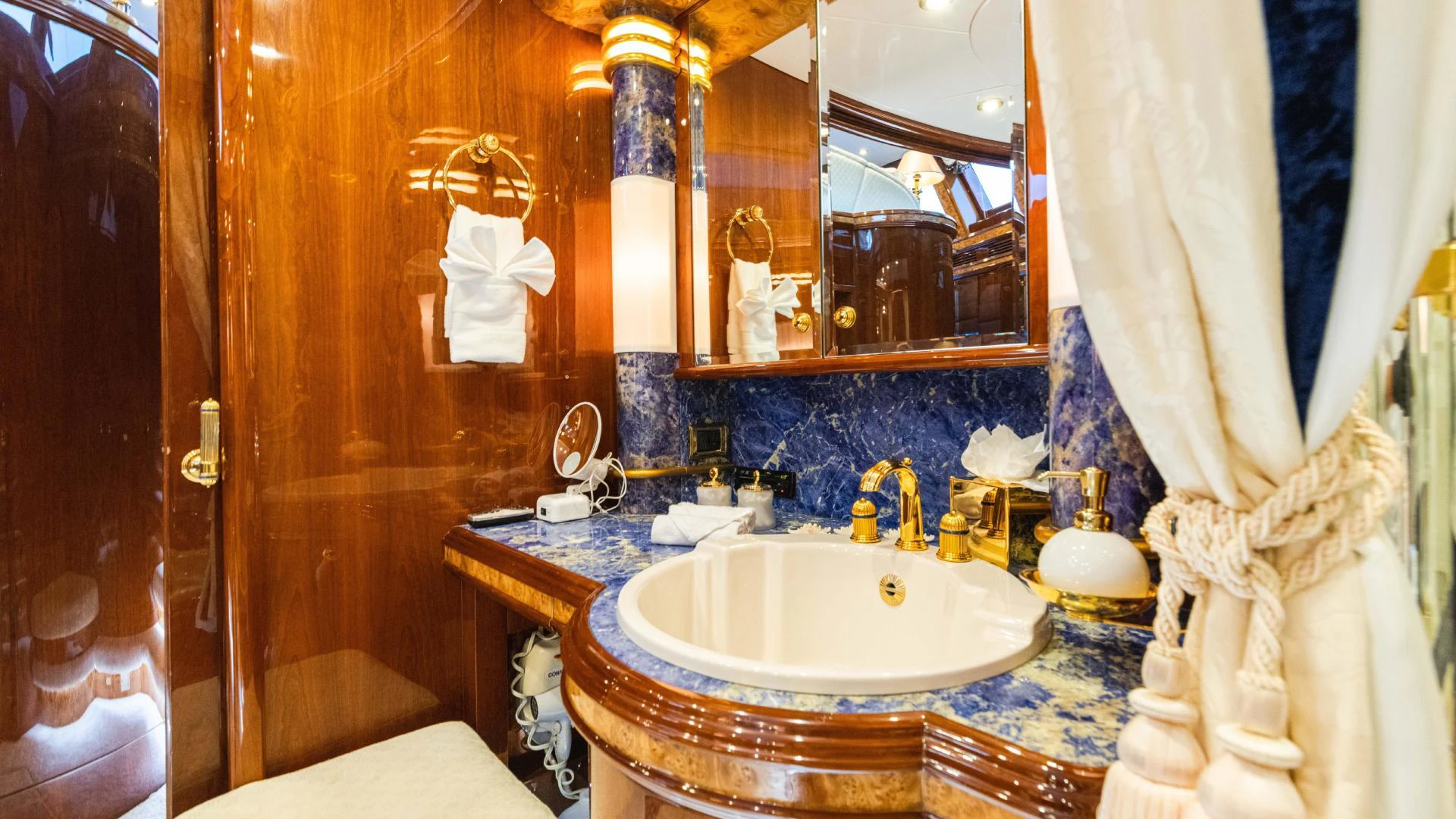 a bathroom with a sink and mirror aboard ARTHUR’S WAY Yacht for Sale