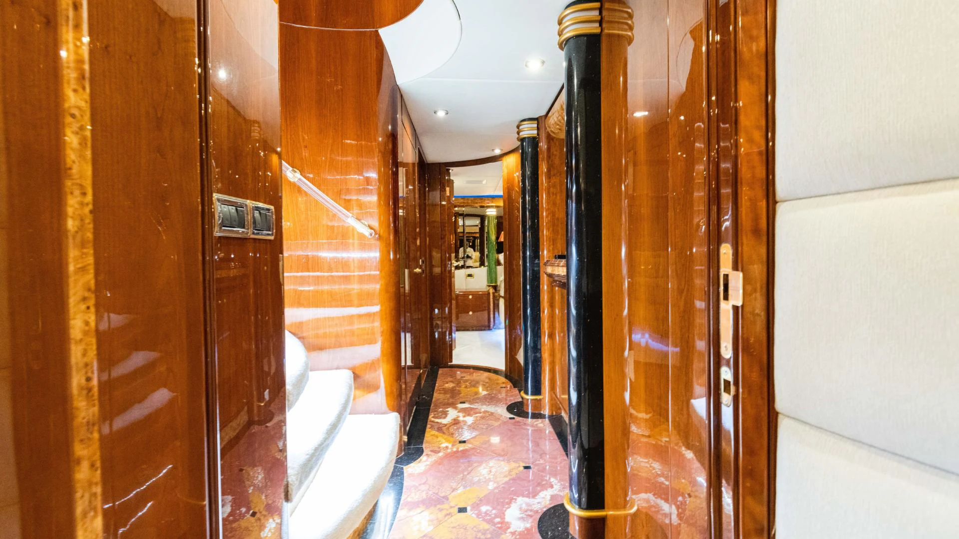 a hallway with wood doors aboard ARTHUR’S WAY Yacht for Sale