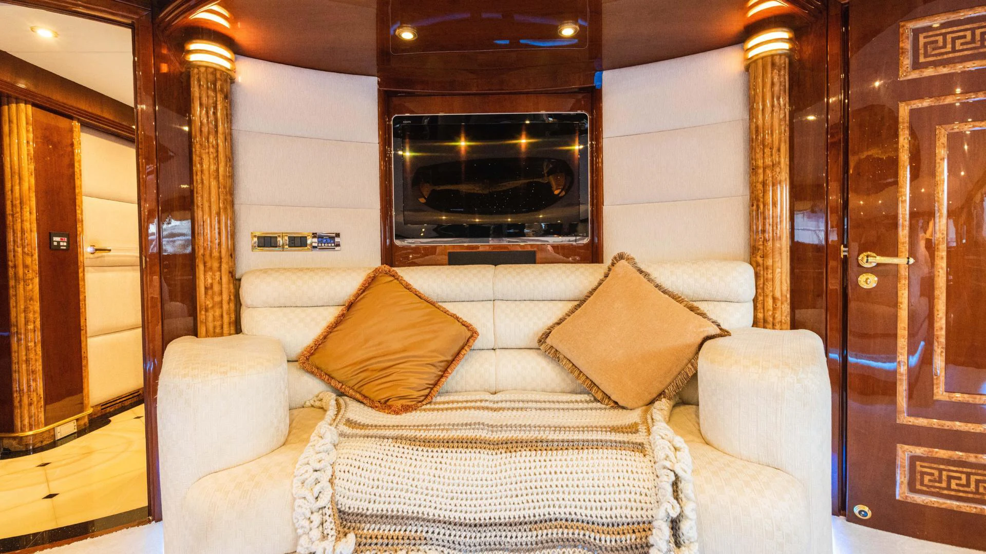 a living room with a fireplace aboard ARTHUR’S WAY Yacht for Sale