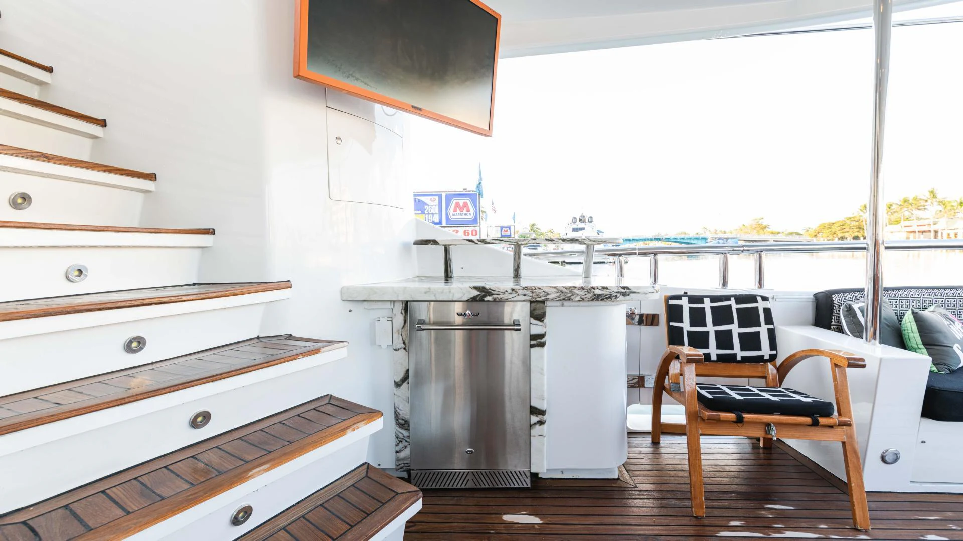 a kitchen with a stove and a chair aboard ARTHUR’S WAY Yacht for Sale