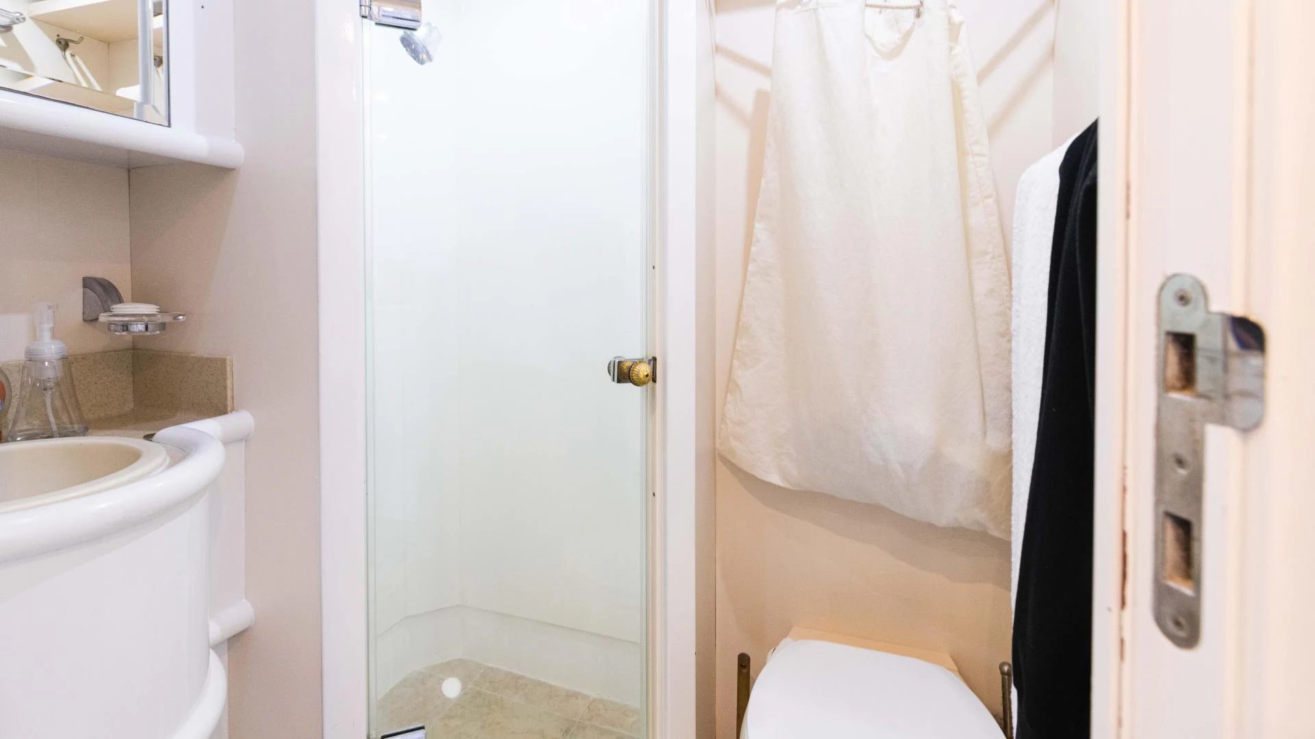a bathroom with a toilet and sink aboard ARTHUR’S WAY Yacht for Sale