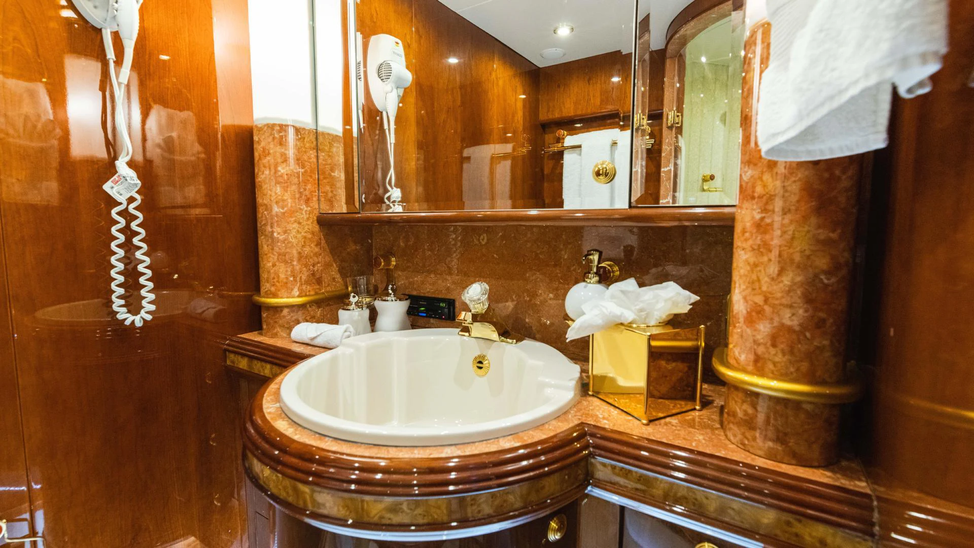 a bathroom with a sink and a mirror aboard ARTHUR’S WAY Yacht for Sale