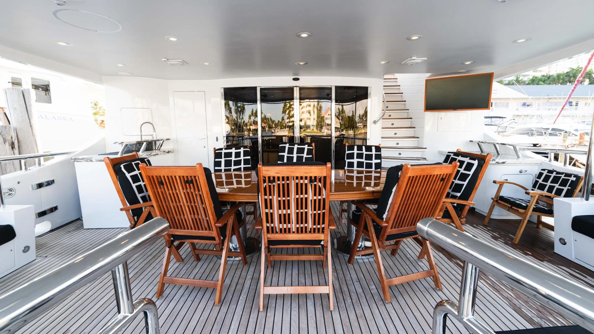 a room with chairs and tables aboard ARTHUR’S WAY Yacht for Sale