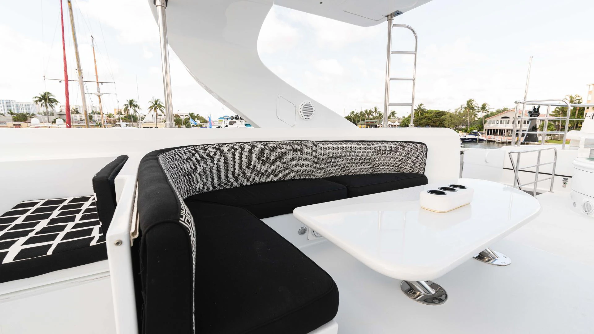 a black chair on a white table aboard ARTHUR’S WAY Yacht for Sale