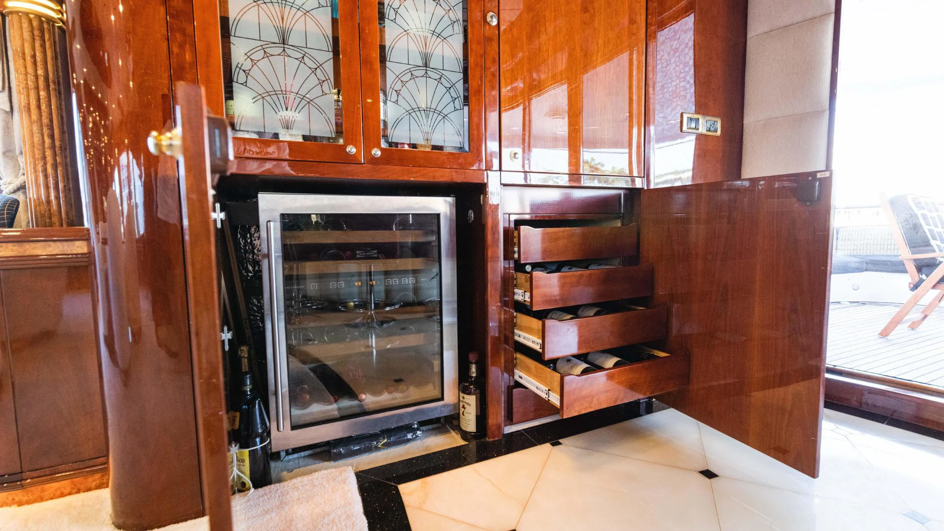 a kitchen with wooden cabinets aboard ARTHUR’S WAY Yacht for Sale