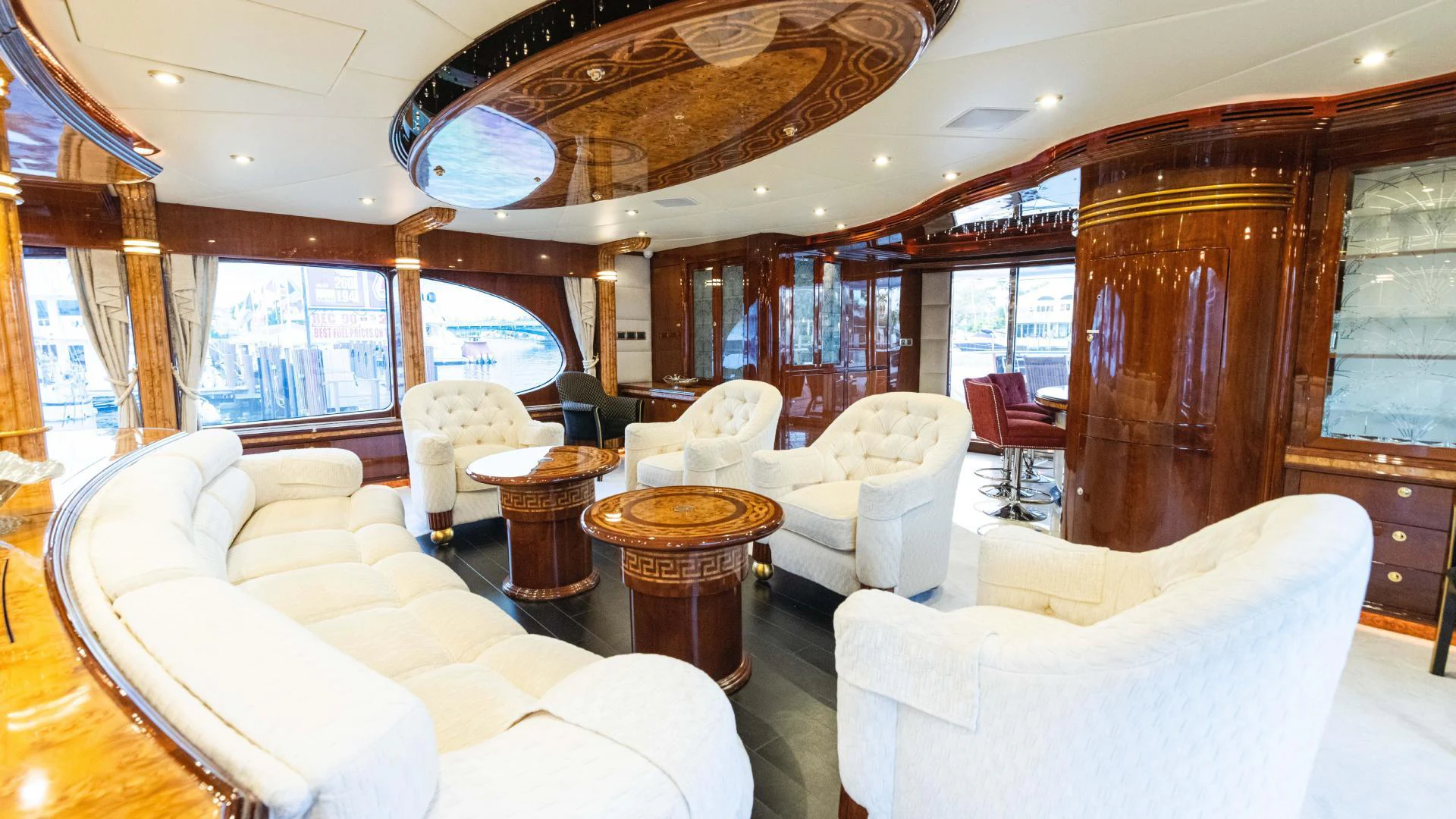 a large living room with a wood wall aboard ARTHUR’S WAY Yacht for Sale