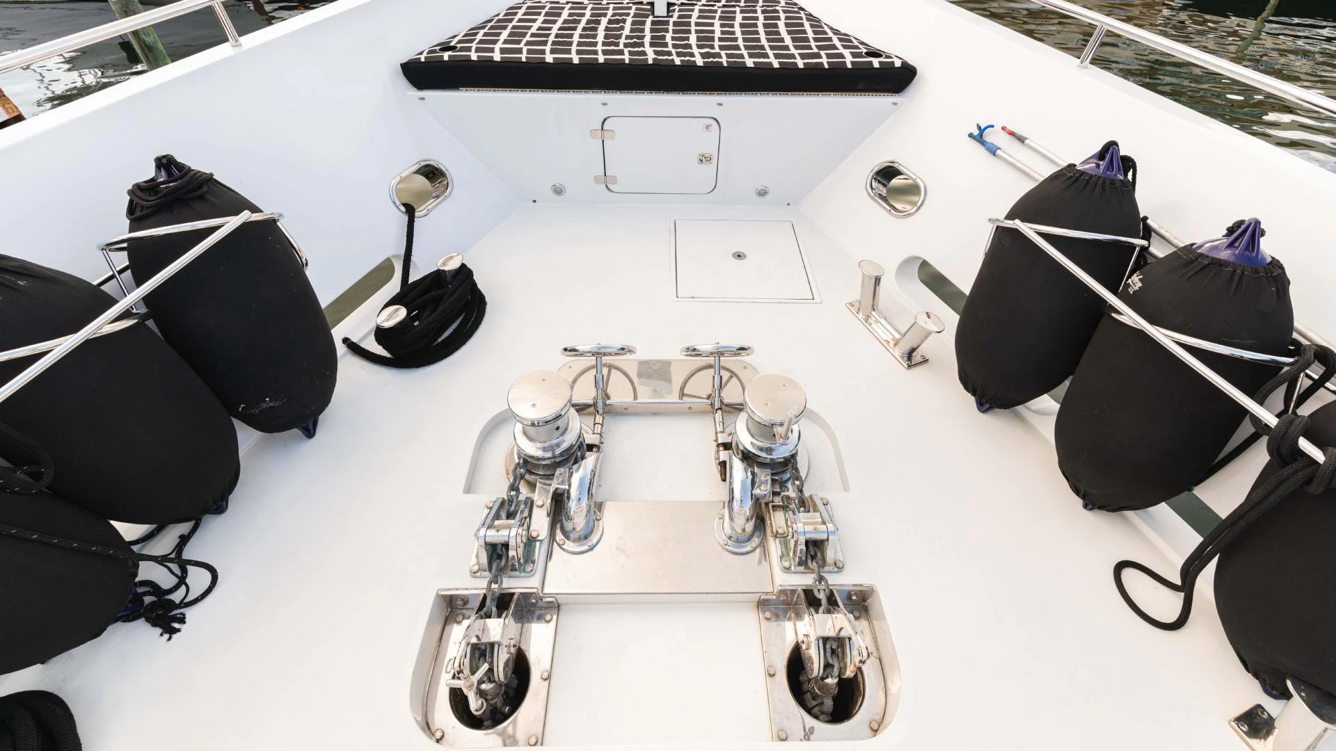 a white table with a white table and chairs with a white table and black chairs and a white aboard ARTHUR’S WAY Yacht for Sale