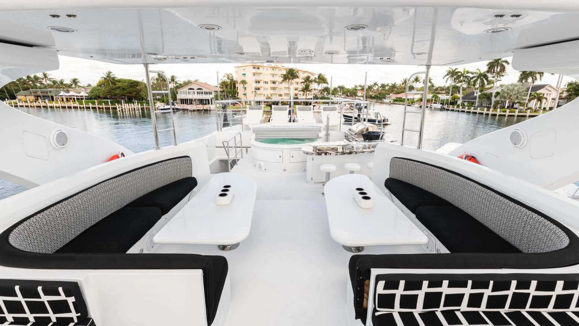a room with a view of a city and a pool aboard ARTHUR’S WAY Yacht for Sale