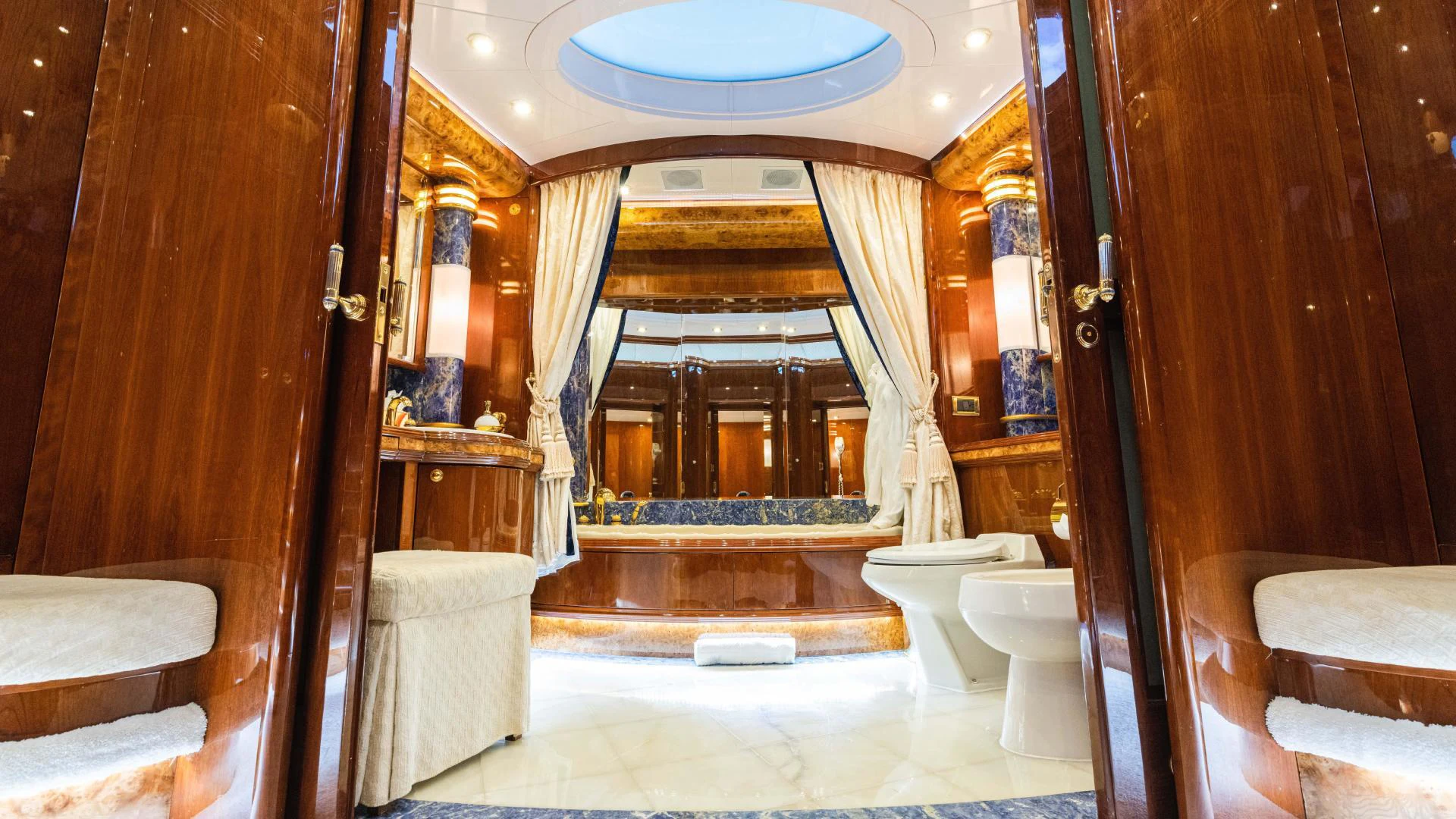 a bathroom with a large mirror aboard ARTHUR’S WAY Yacht for Sale
