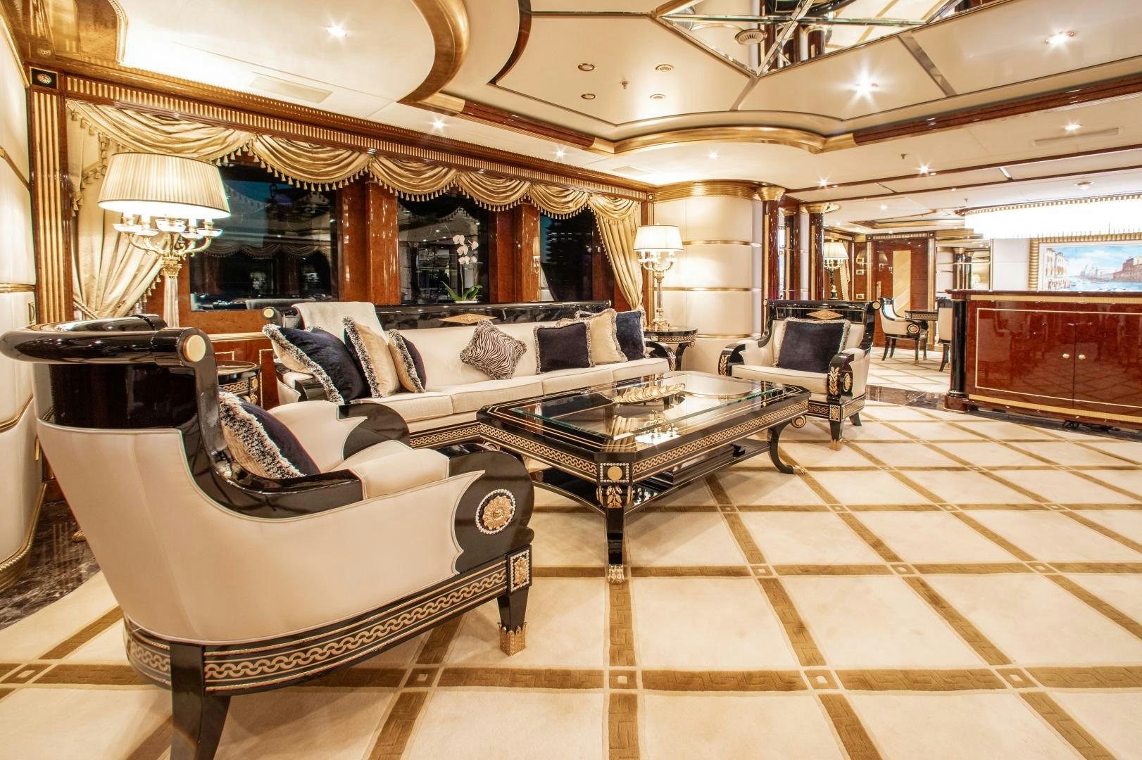 a large living room with a large mirror aboard SORRENTO Yacht for Sale