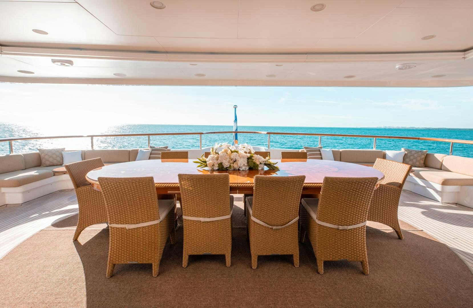 a table and chairs on a patio aboard SORRENTO Yacht for Sale