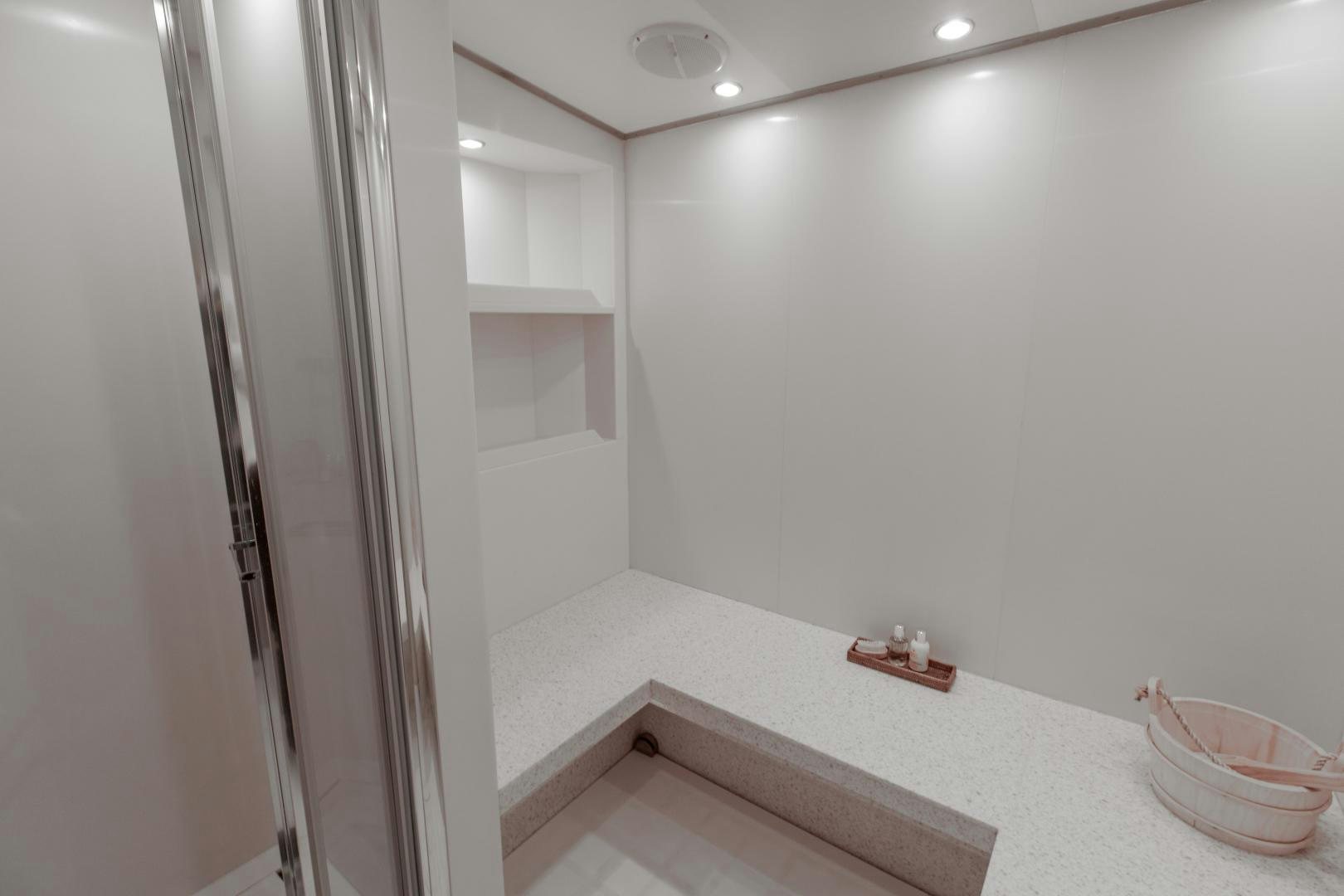 a bathroom with a glass shower aboard SORRENTO Yacht for Sale