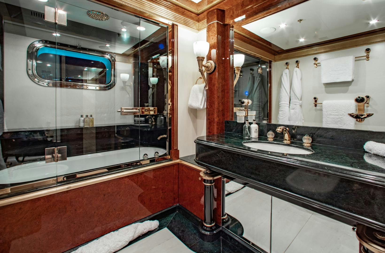 a bathroom with a large mirror aboard SORRENTO Yacht for Sale