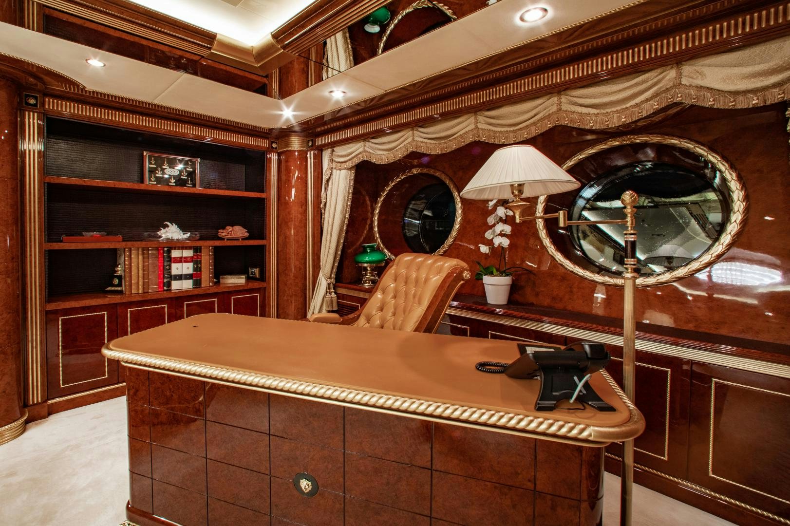 a wooden room with a piano and a chandelier aboard SORRENTO Yacht for Sale