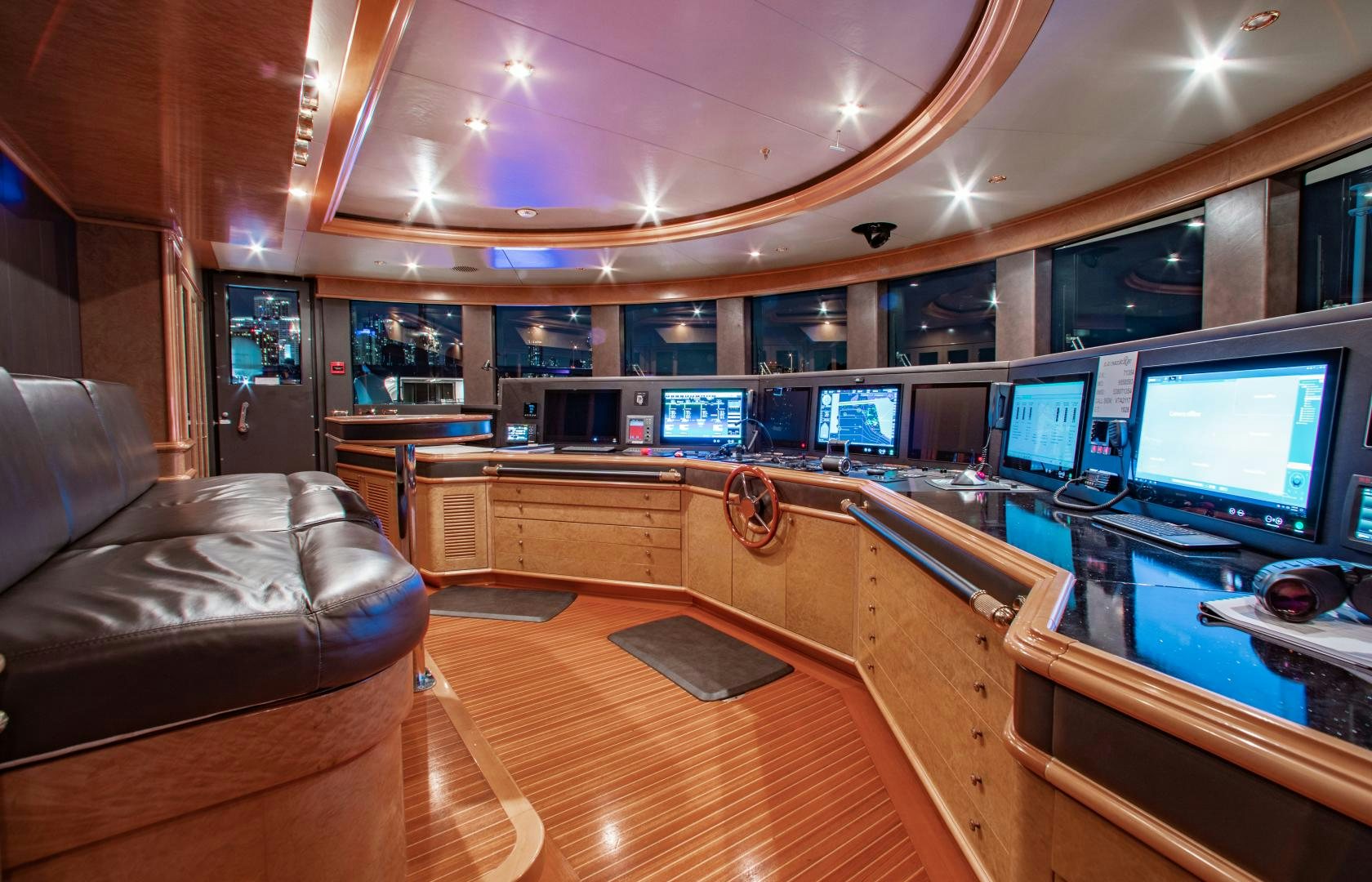 a room with a couch and a tv aboard SORRENTO Yacht for Sale