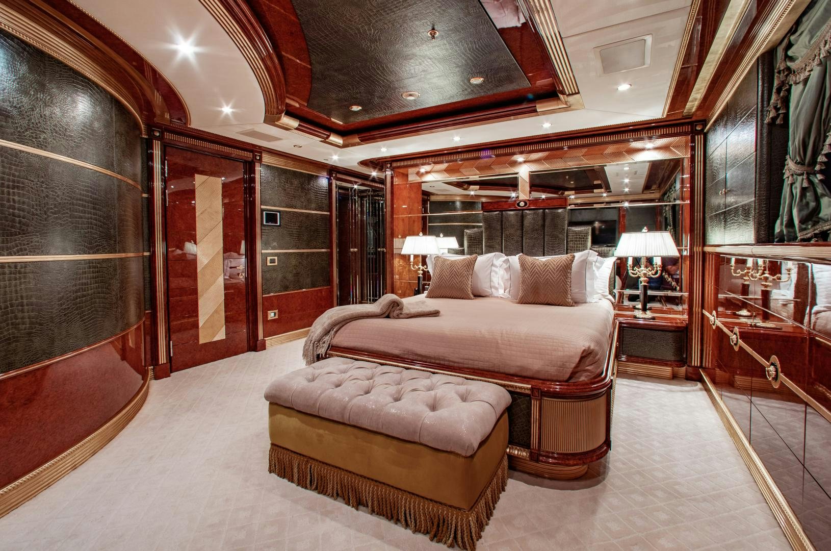 a large room with a bed and a large mirror aboard SORRENTO Yacht for Sale