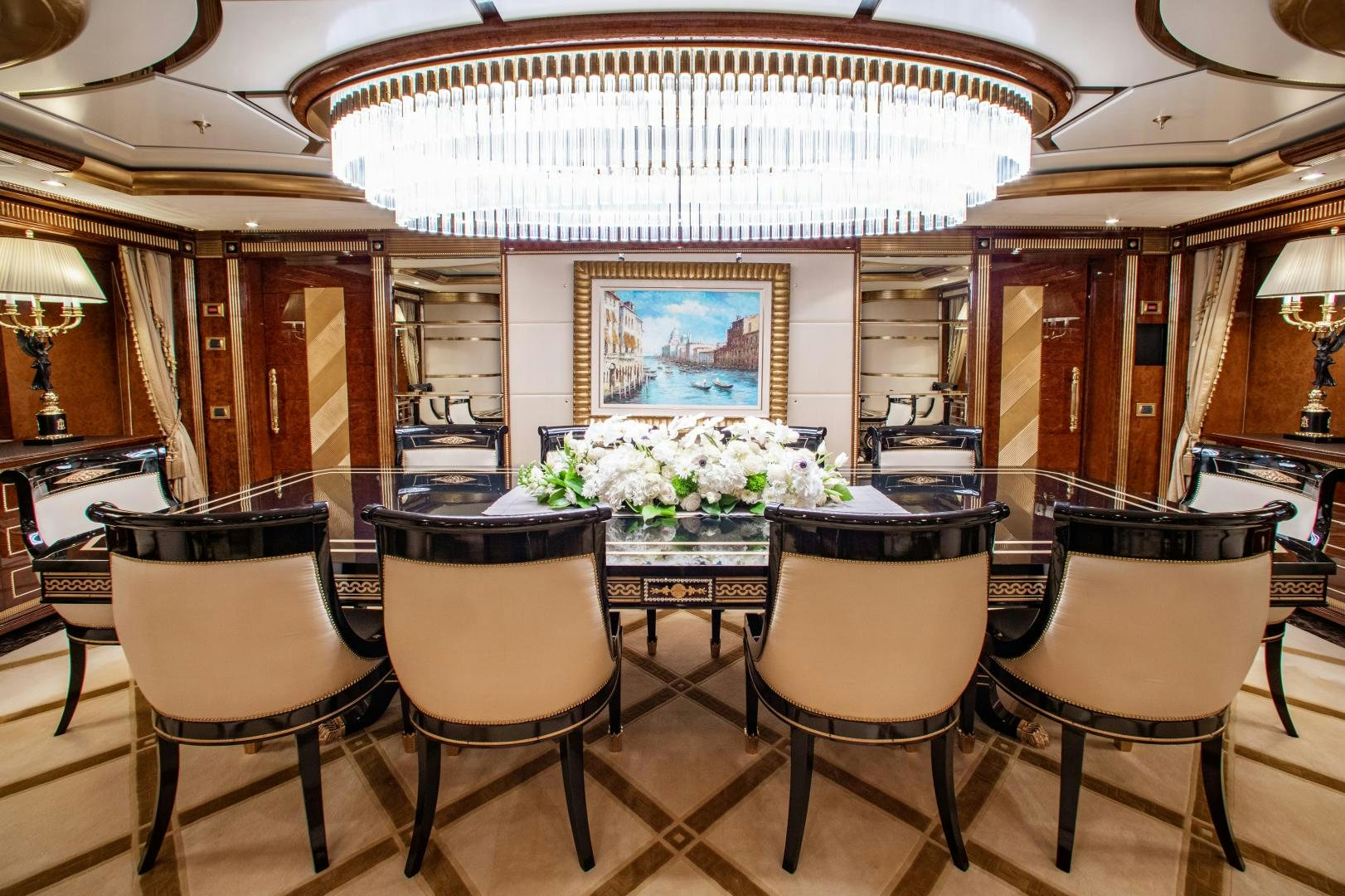 a room with a table and chairs aboard SORRENTO Yacht for Sale