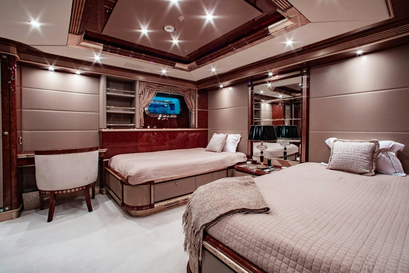 a room with a bed and a television aboard SORRENTO Yacht for Sale