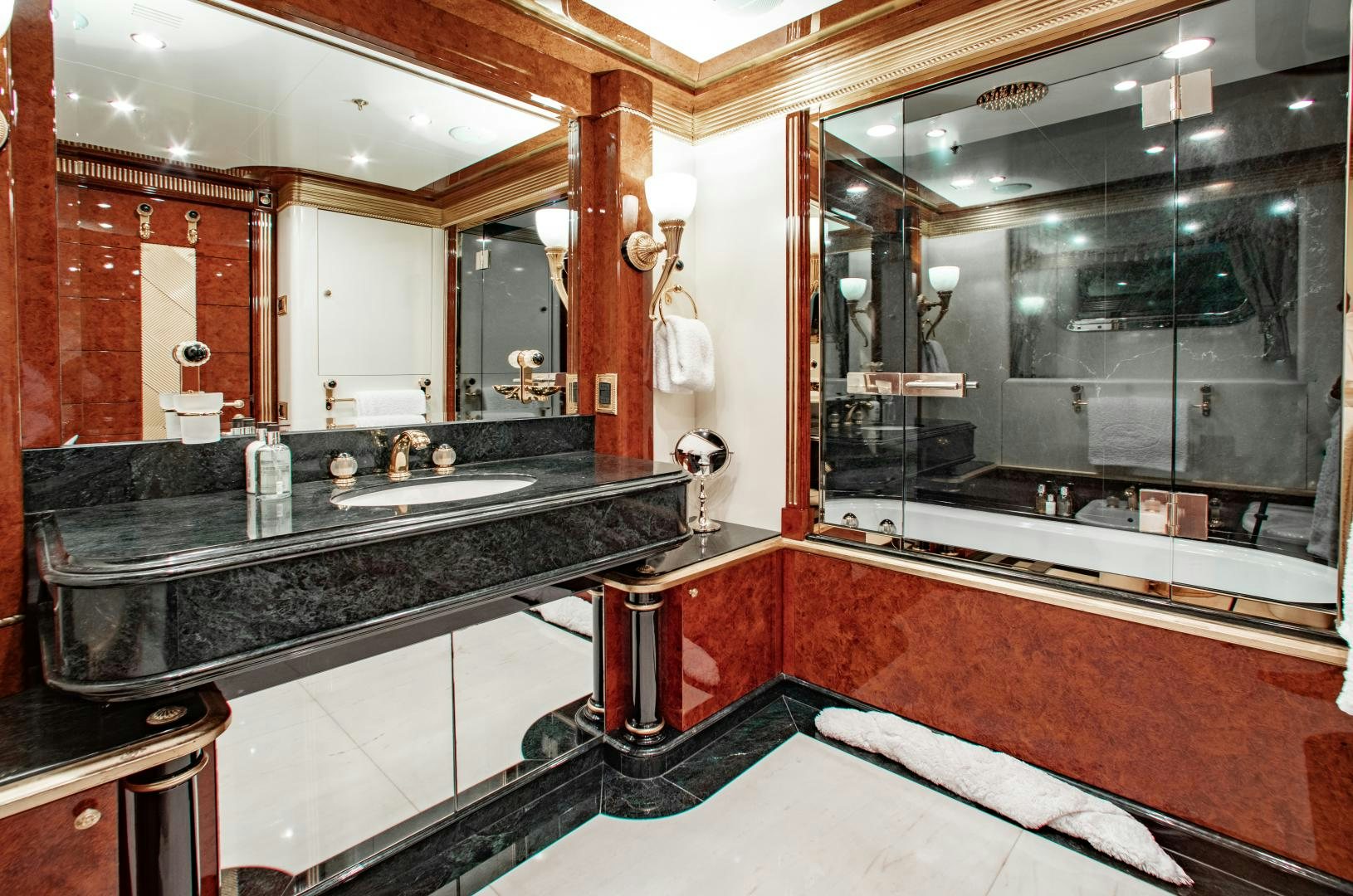 a bathroom with a large mirror aboard SORRENTO Yacht for Sale