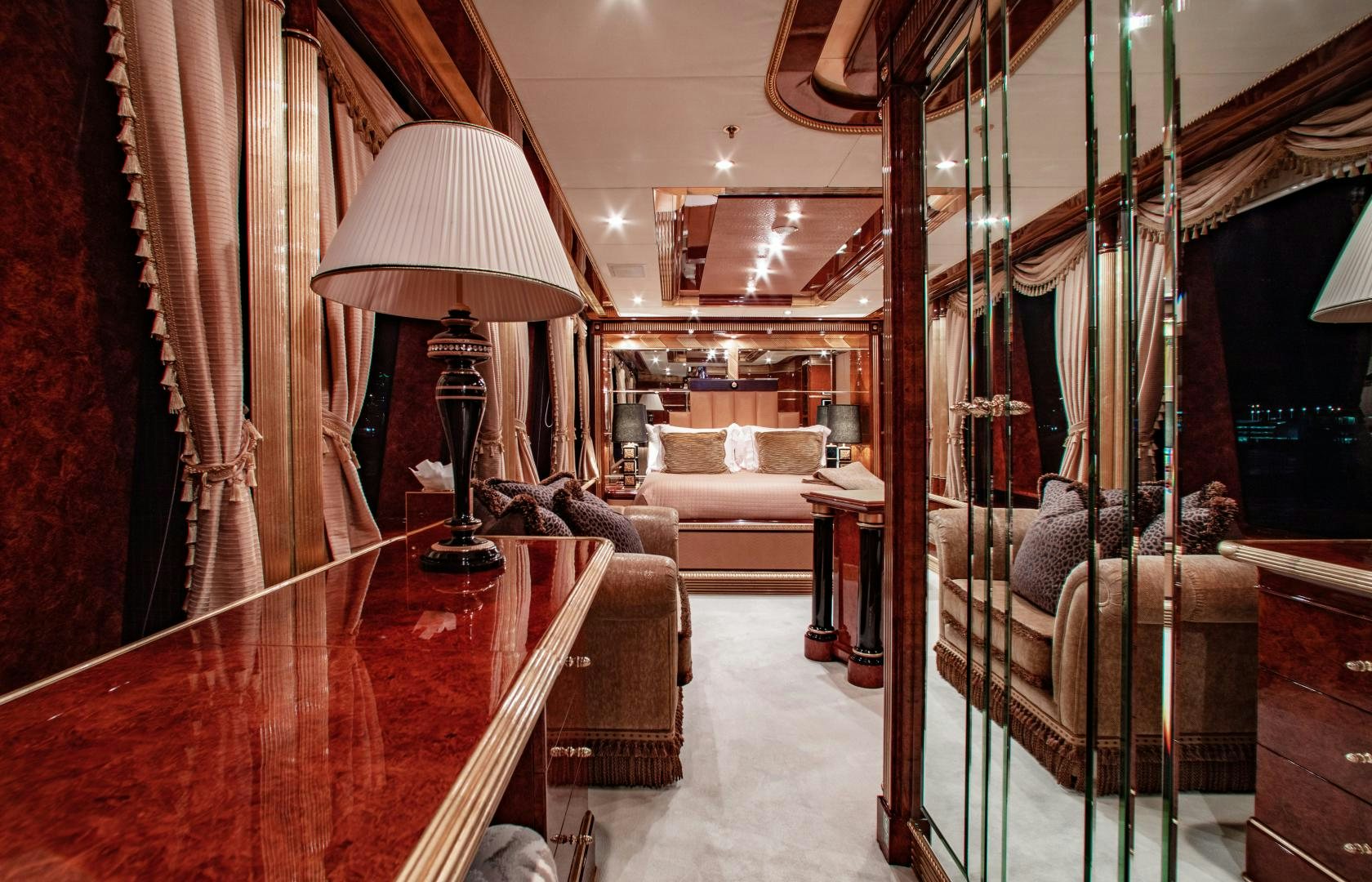 a room with a bed and a lamp aboard SORRENTO Yacht for Sale