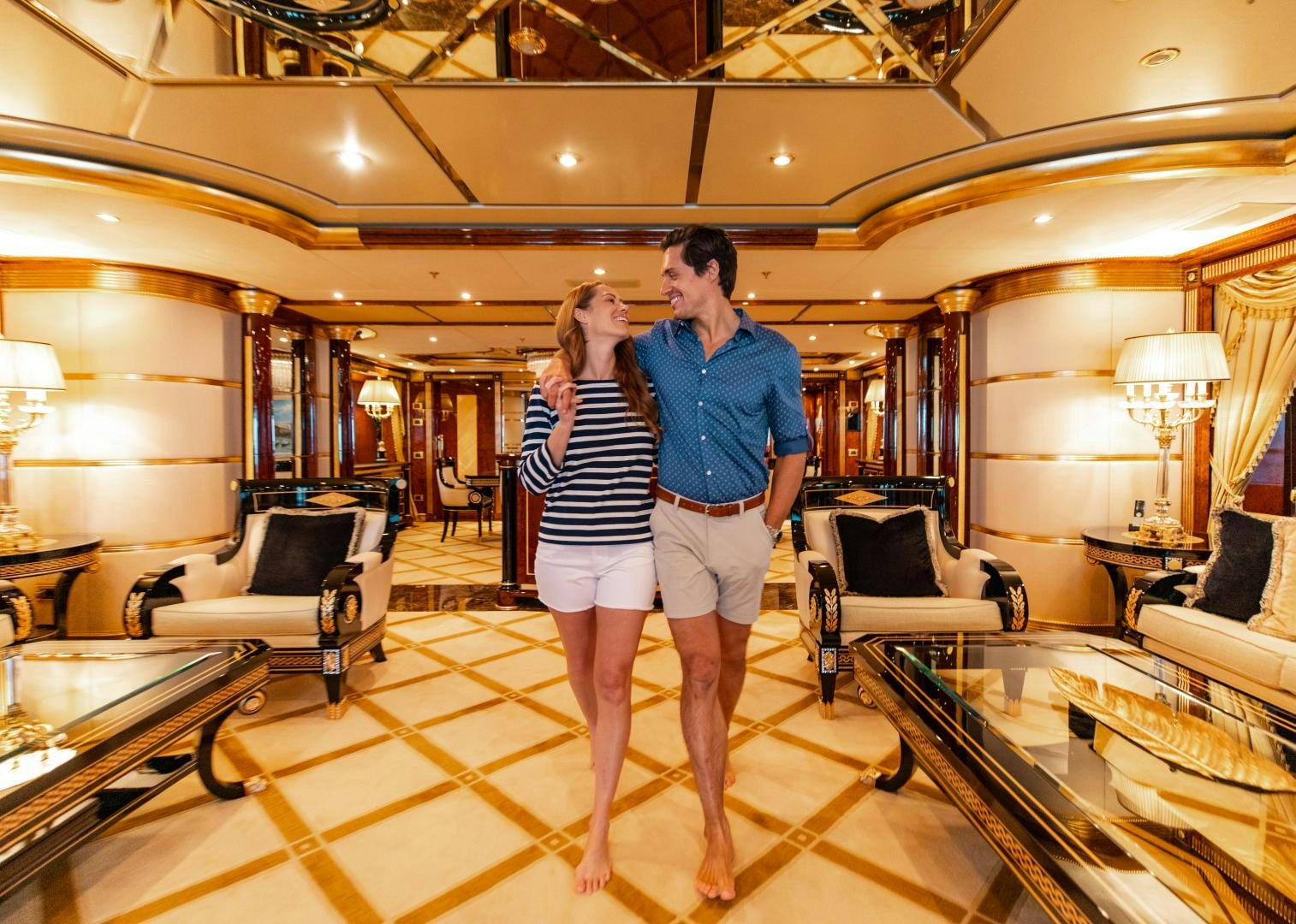 a man and woman in a hotel room taking a picture aboard SORRENTO Yacht for Sale