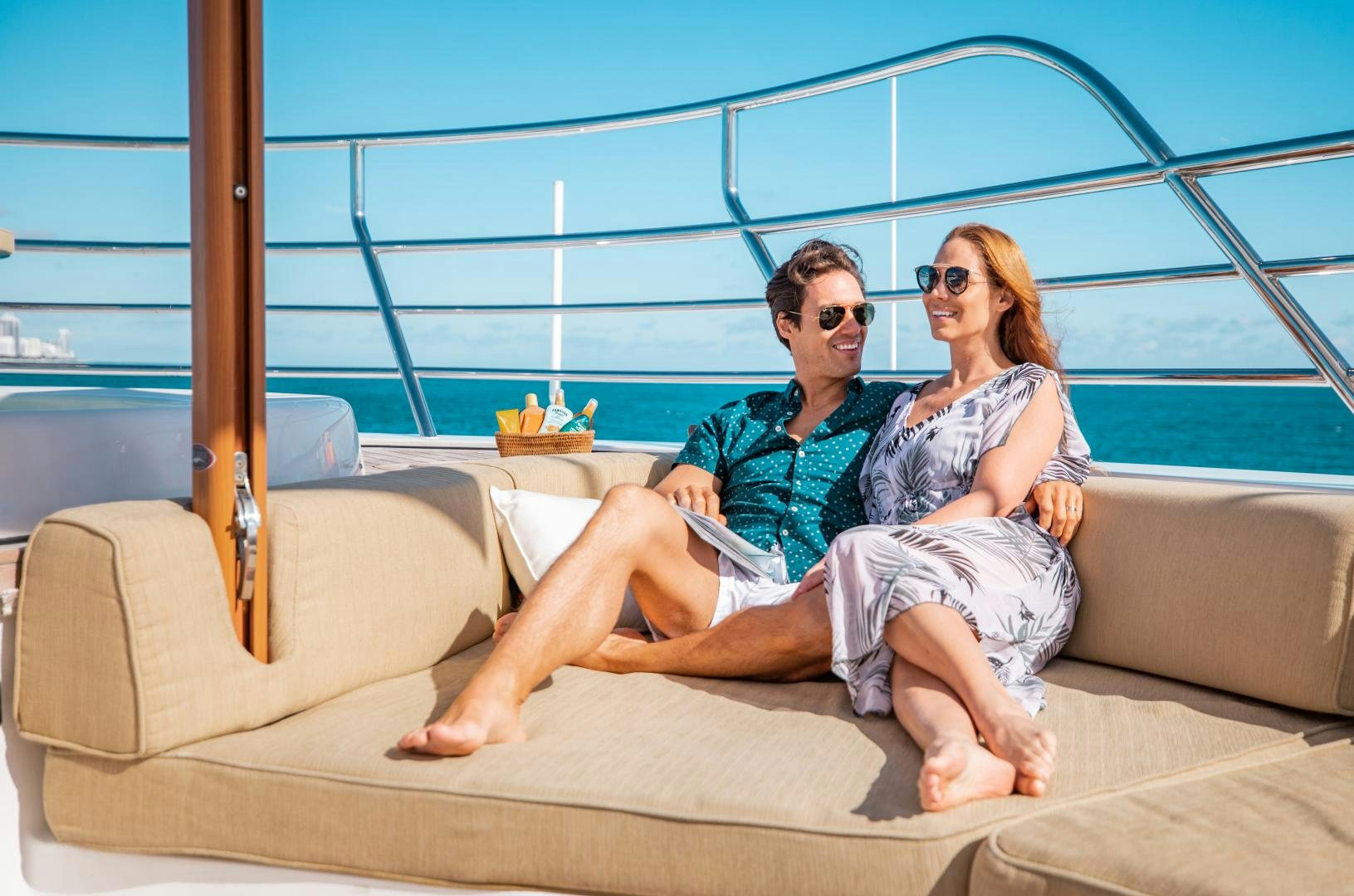 a man and woman sitting on a couch aboard SORRENTO Yacht for Sale
