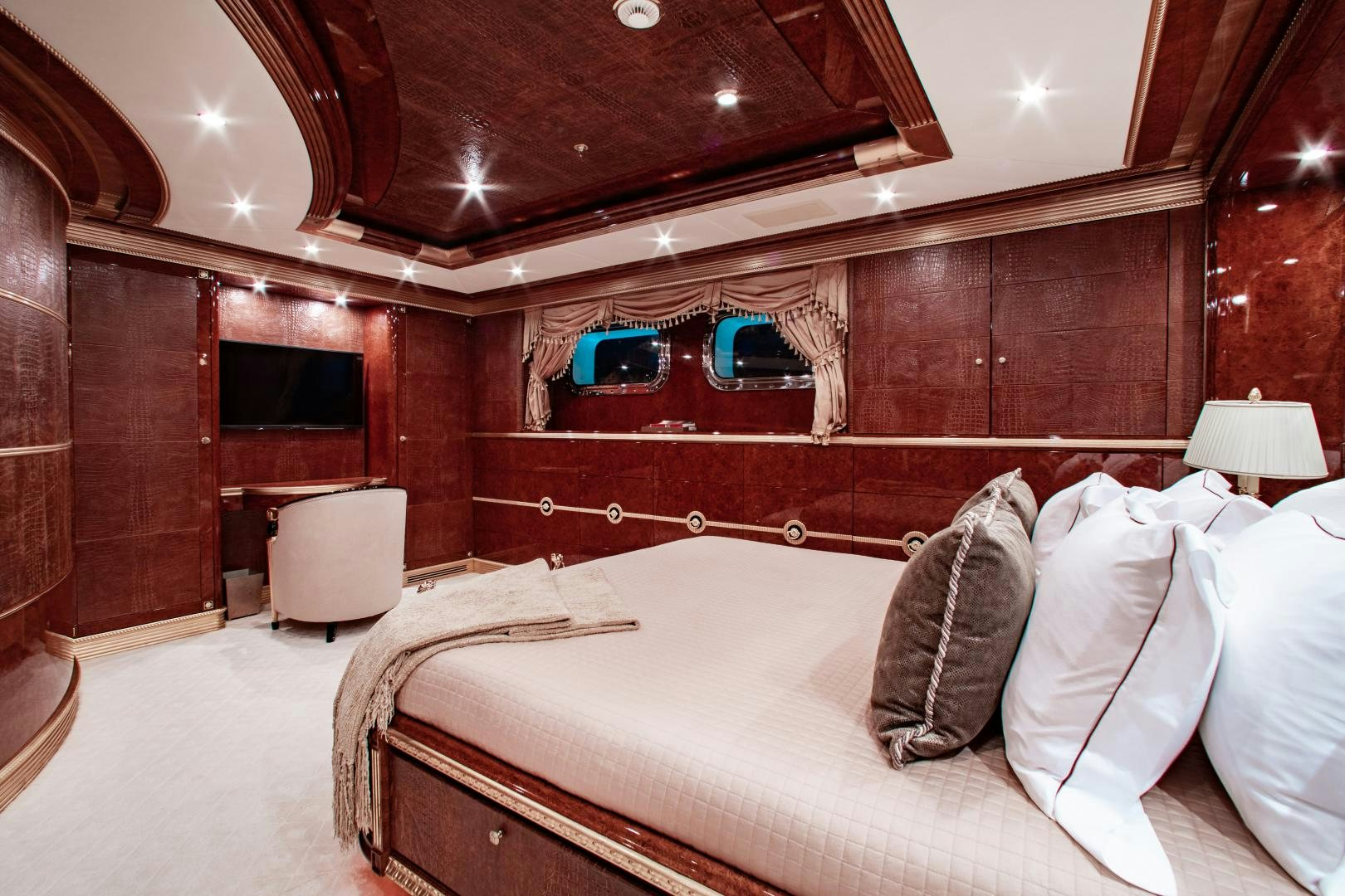 a room with a bed and a mirror aboard SORRENTO Yacht for Sale