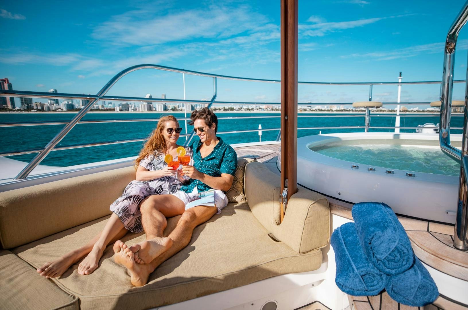 a man and woman sitting on a boat with a baby aboard SORRENTO Yacht for Sale