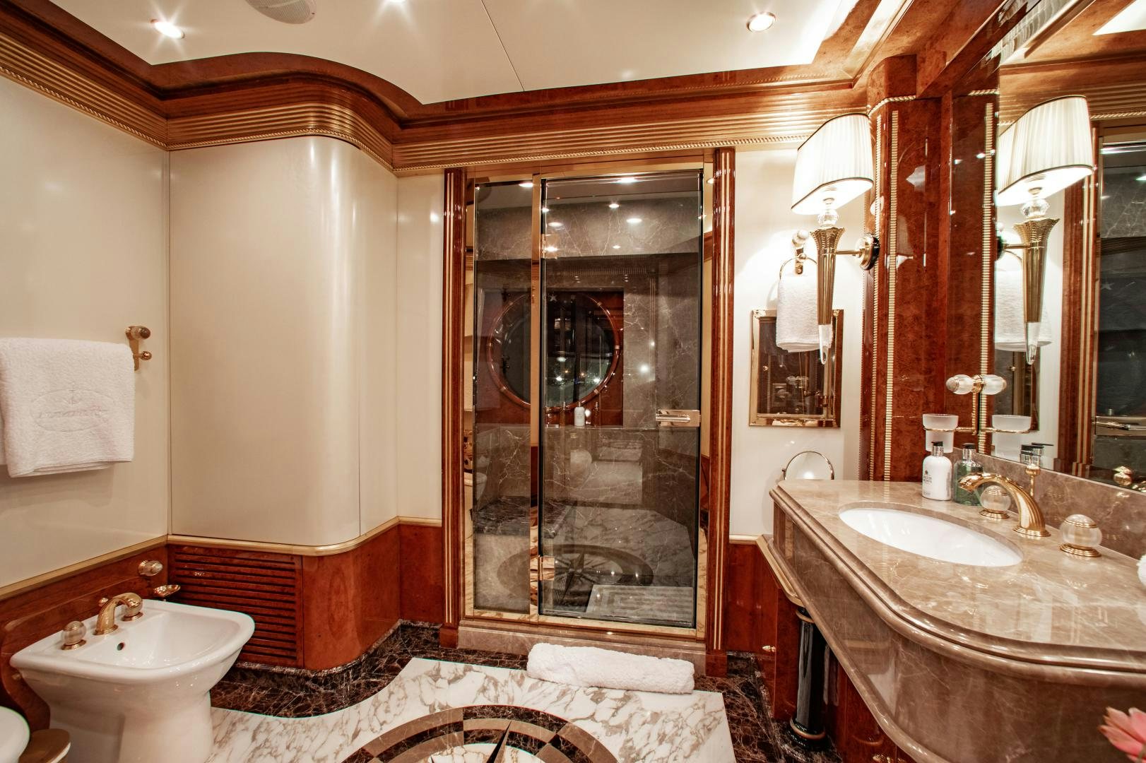 a bathroom with a large glass shower aboard SORRENTO Yacht for Sale