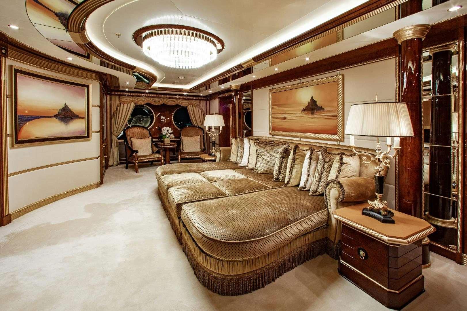 a living room with a large chandelier aboard SORRENTO Yacht for Sale