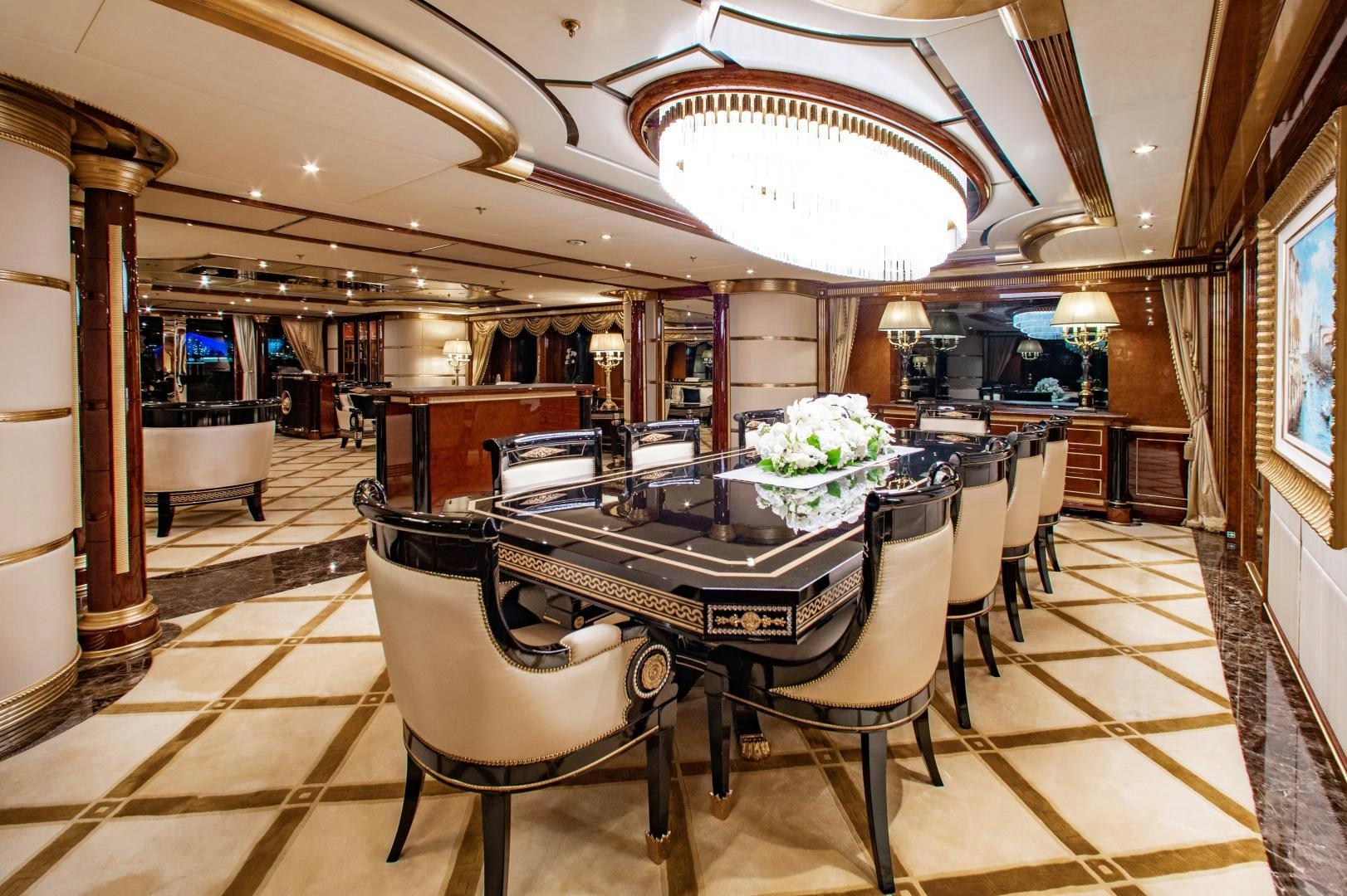 a room with a table and chairs aboard SORRENTO Yacht for Sale