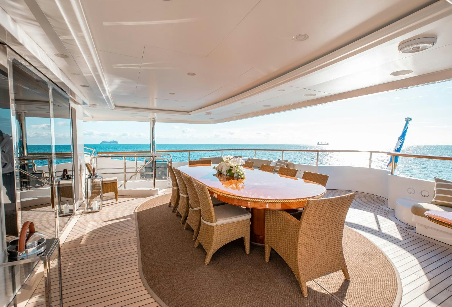 a room with a table and chairs aboard SORRENTO Yacht for Sale