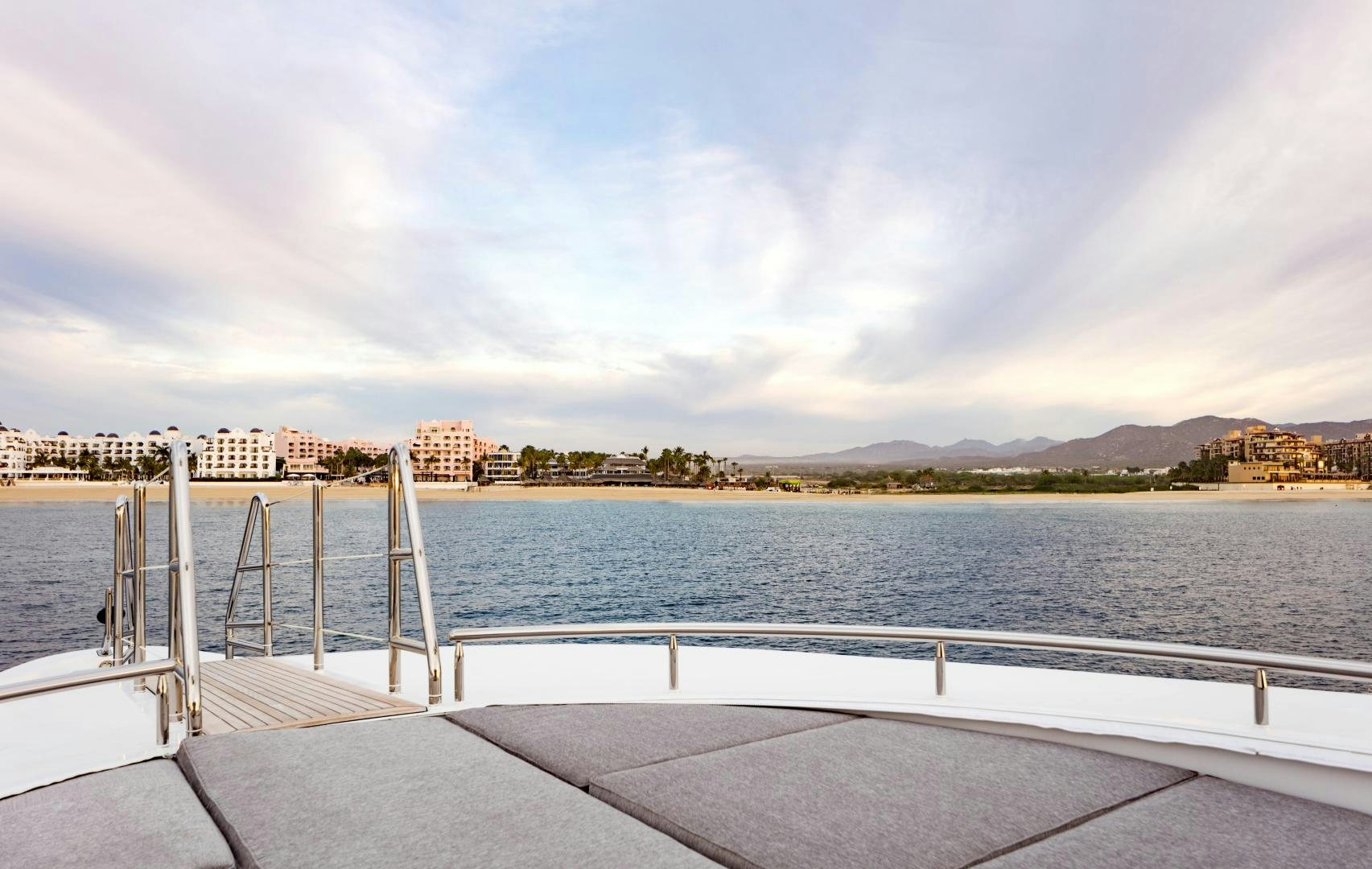 a dock with a body of water in the background aboard CHAMPAGNE SEAS Yacht for Sale