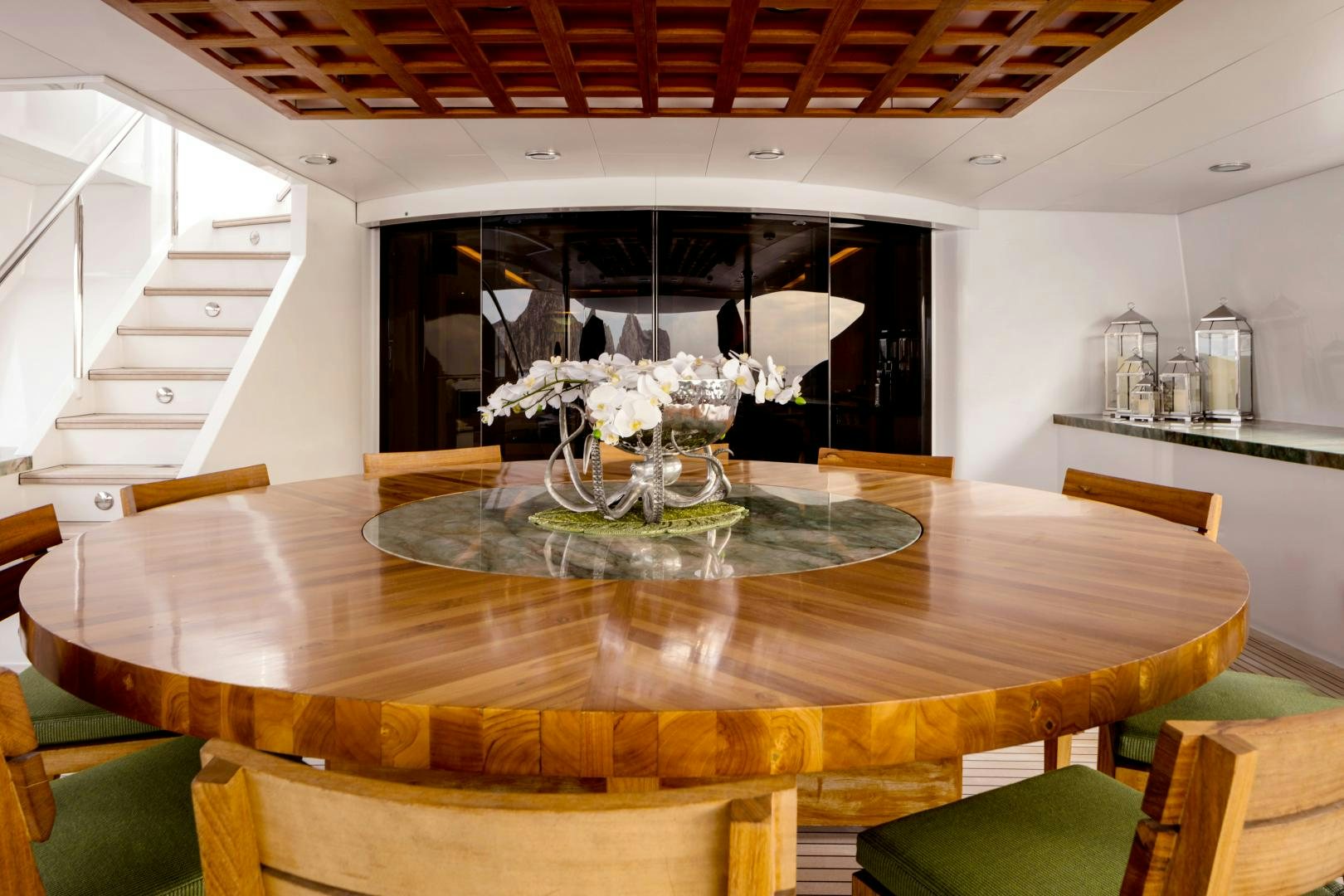 a dining table with flowers aboard CHAMPAGNE SEAS Yacht for Sale