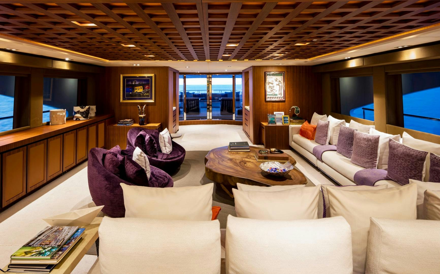 a living room with a large window aboard CHAMPAGNE SEAS Yacht for Sale