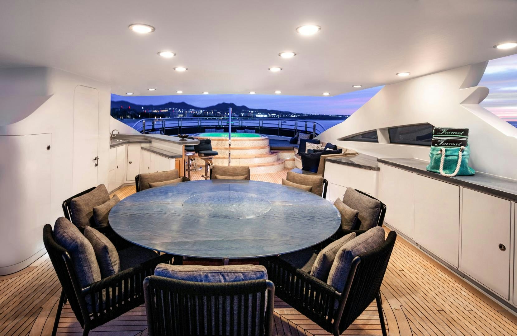 a large kitchen with a table and chairs aboard CHAMPAGNE SEAS Yacht for Sale