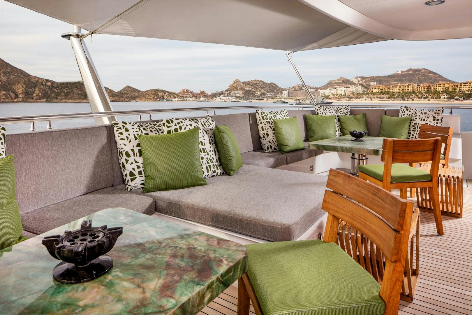 a couch and chairs in a tent aboard CHAMPAGNE SEAS Yacht for Sale