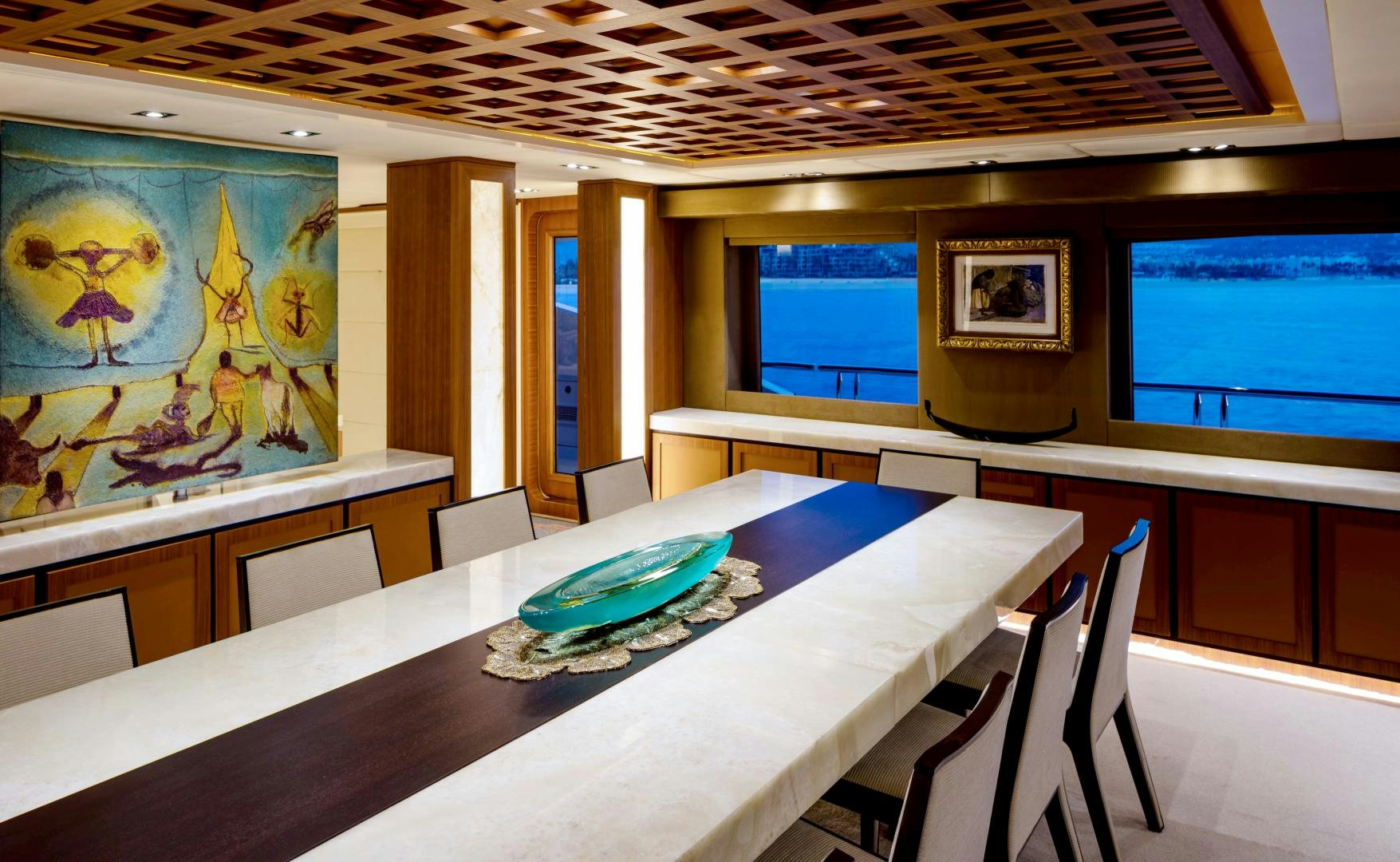 a room with tables and chairs aboard CHAMPAGNE SEAS Yacht for Sale