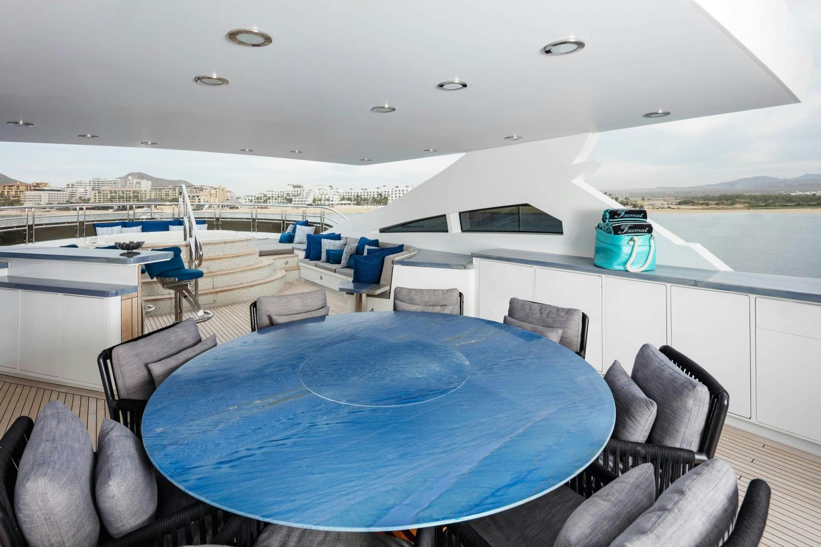 a large room with a table and chairs aboard CHAMPAGNE SEAS Yacht for Charter