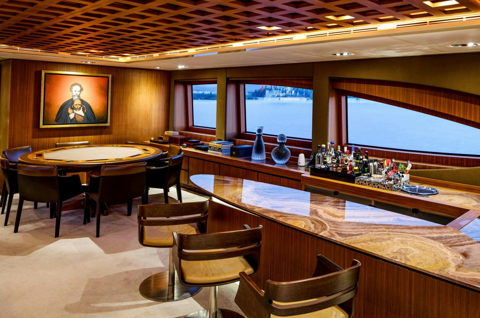 a bar with a table and chairs aboard CHAMPAGNE SEAS Yacht for Sale